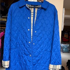 Burberry Beige Plaid Quilted Jacket in blue with snaps in good used condition.